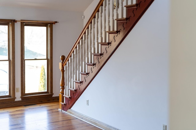 staircase featuring hardwood / wood-style flooring