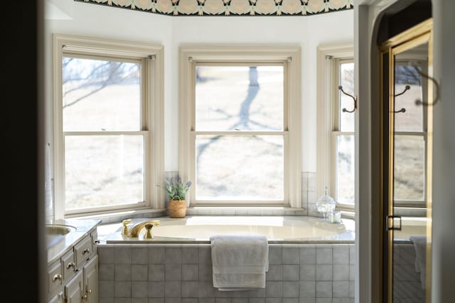 bathroom with vanity and plenty of natural light