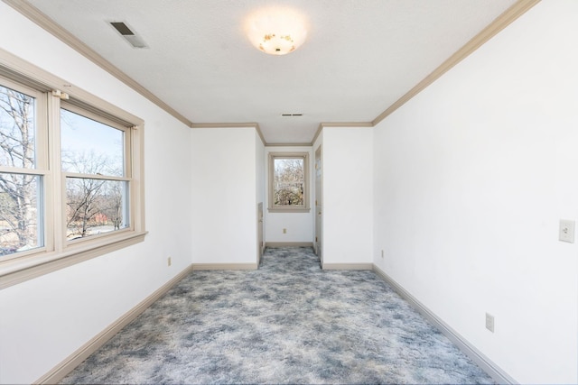 unfurnished room featuring crown molding and carpet flooring