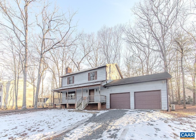 front facade featuring a porch and a garage