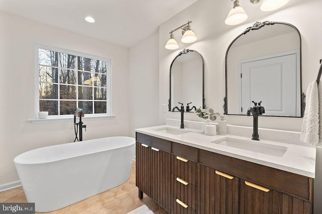 bathroom featuring vanity and a bathtub