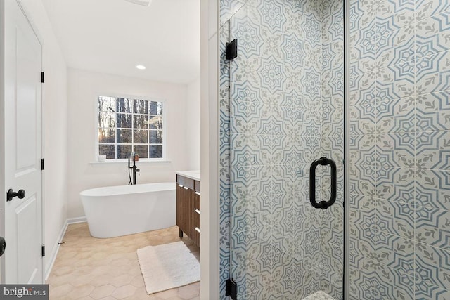 bathroom featuring independent shower and bath and vanity