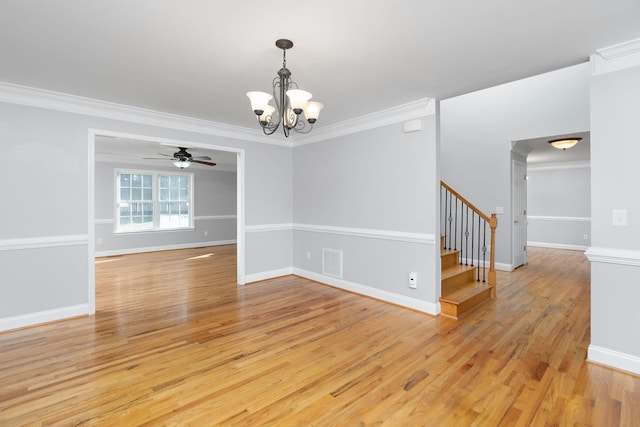 unfurnished room featuring stairway, visible vents, light wood finished floors, and ornamental molding