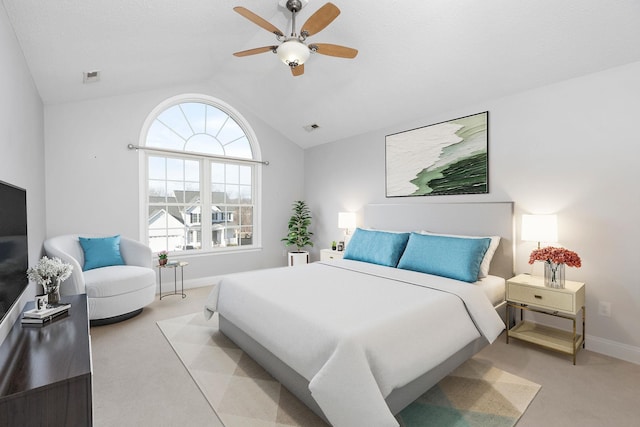 bedroom featuring carpet floors, visible vents, and vaulted ceiling