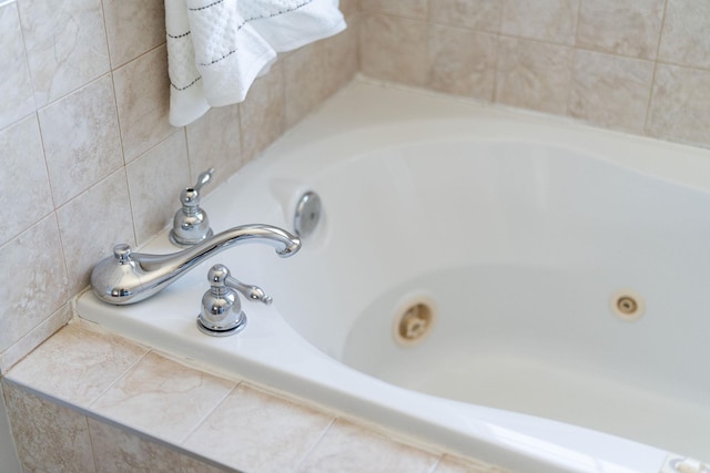 interior details featuring a jetted tub