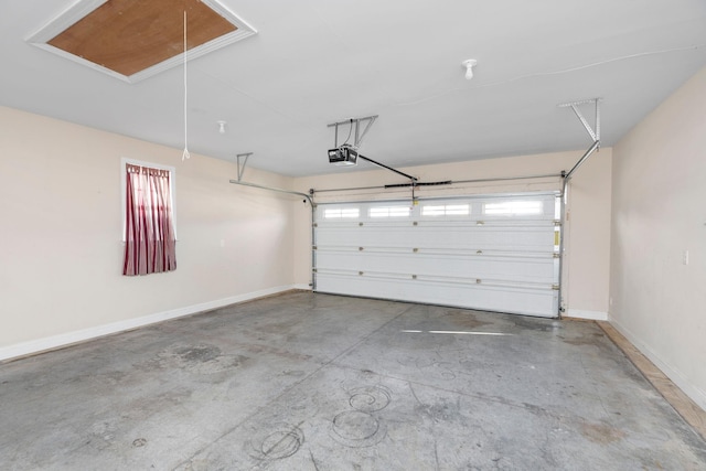 garage with baseboards and a garage door opener