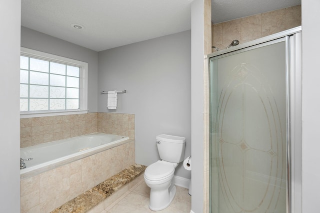 full bathroom with a garden tub, toilet, a shower stall, a textured ceiling, and tile patterned flooring