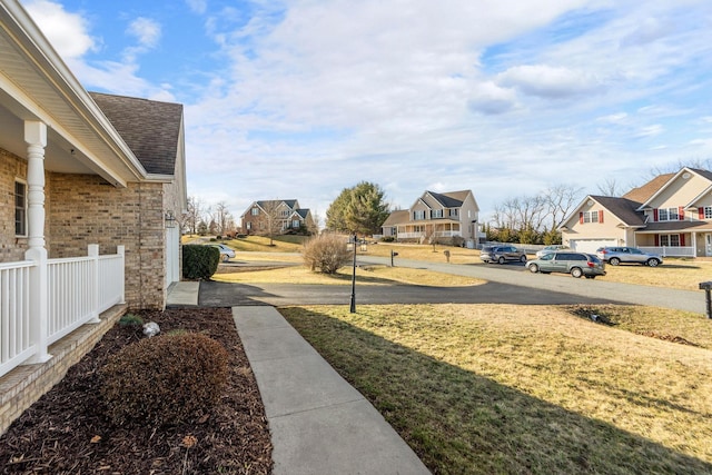 view of yard featuring a residential view