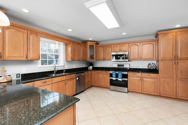 kitchen featuring appliances with stainless steel finishes, a sink, and recessed lighting