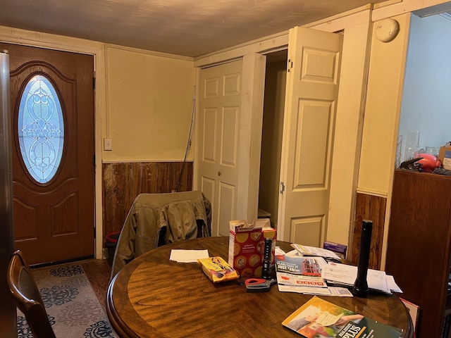 entryway featuring wooden walls