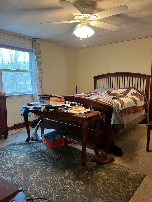 bedroom with ceiling fan and carpet flooring