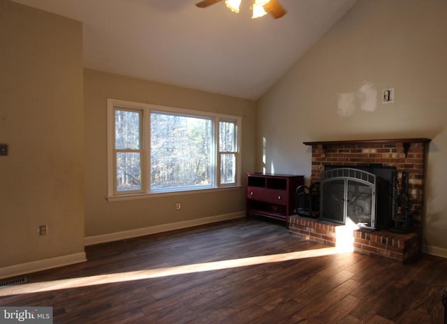 unfurnished living room featuring a brick fireplace, dark hardwood / wood-style floors, high vaulted ceiling, and ceiling fan