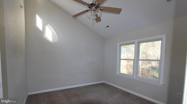 unfurnished room featuring dark carpet, ceiling fan, and vaulted ceiling