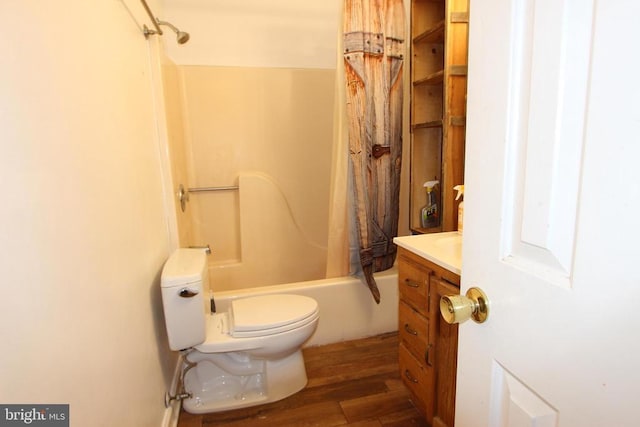 full bathroom featuring shower / tub combo with curtain, vanity, hardwood / wood-style flooring, and toilet