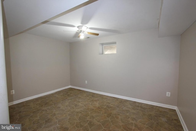 interior space with ceiling fan