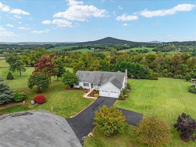 birds eye view of property with a mountain view