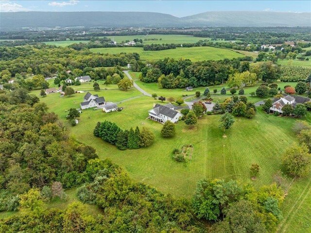 drone / aerial view with a rural view and a mountain view