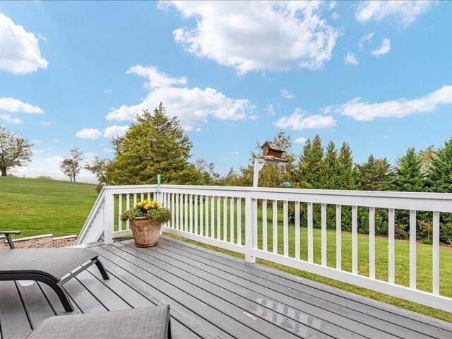 wooden terrace with a yard