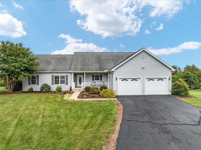 single story home featuring a garage, a front yard, and a porch