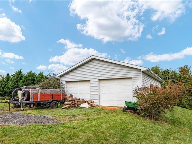 garage featuring a lawn