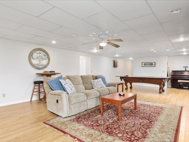 living room with ceiling fan, light hardwood / wood-style floors, billiards, and a drop ceiling