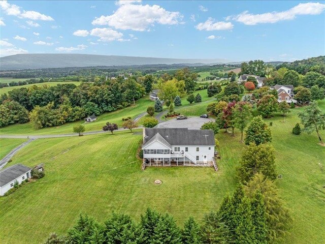 birds eye view of property featuring a rural view