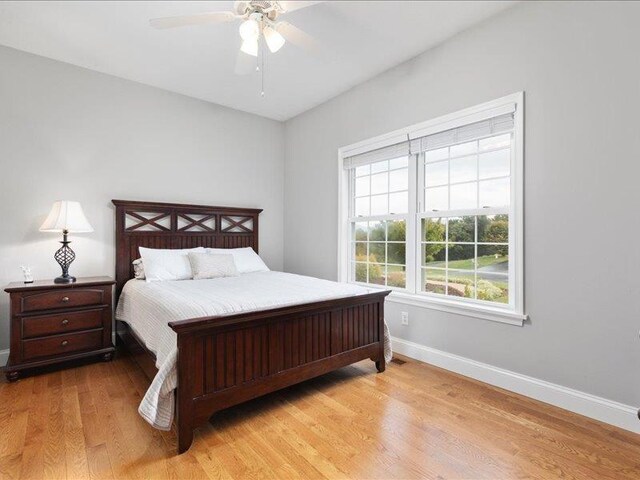 bedroom featuring light hardwood / wood-style floors and ceiling fan