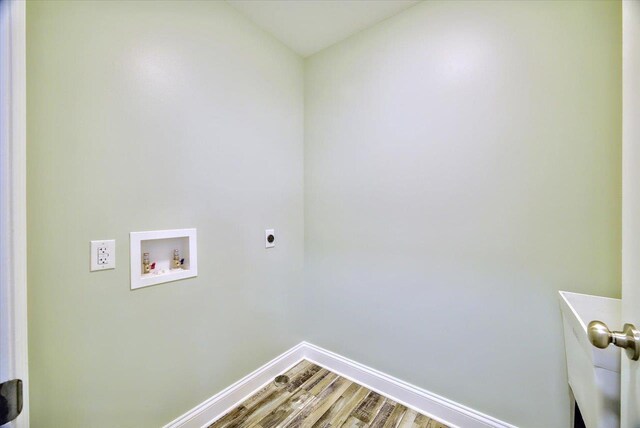 laundry room featuring washer hookup, wood-type flooring, and electric dryer hookup