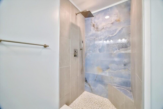 bathroom with a tile shower