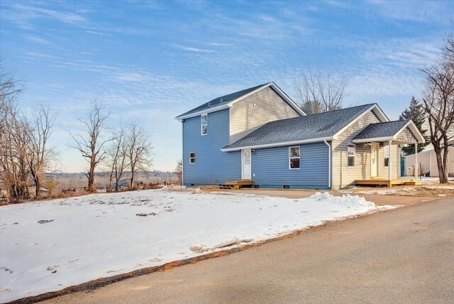 view of snow covered property