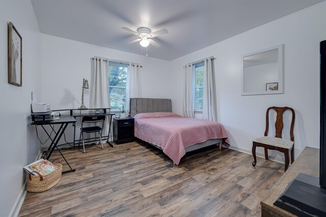 bedroom featuring hardwood / wood-style floors and ceiling fan