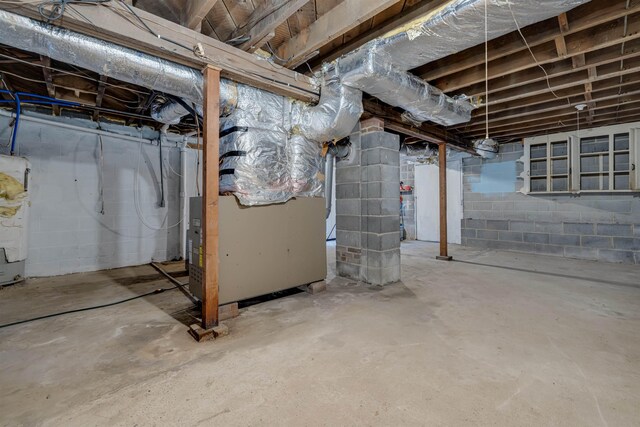 basement with heating unit and water heater