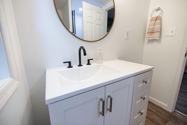 bathroom featuring vanity and hardwood / wood-style floors