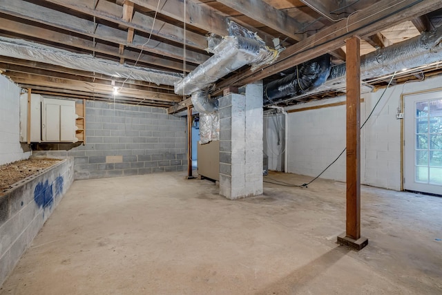 basement featuring heating unit