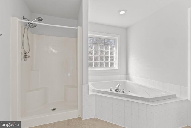 bathroom with separate shower and tub