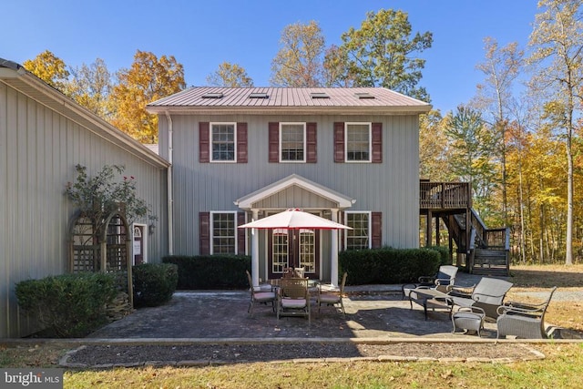 back of house with a patio area