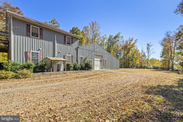 view of side of home with a garage