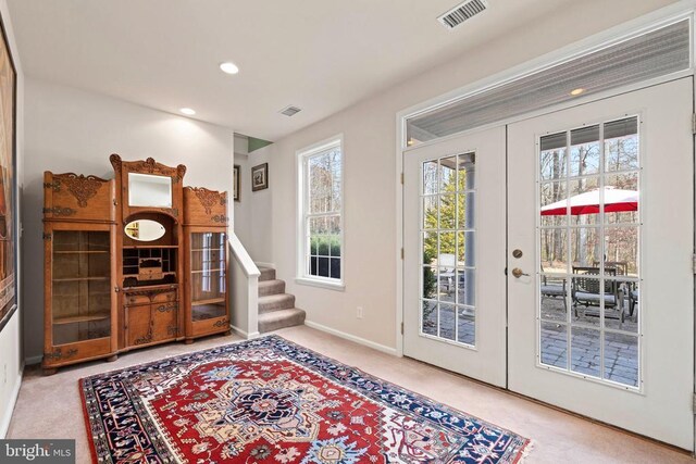 doorway featuring french doors and carpet