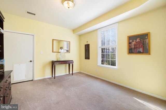 interior space featuring light colored carpet