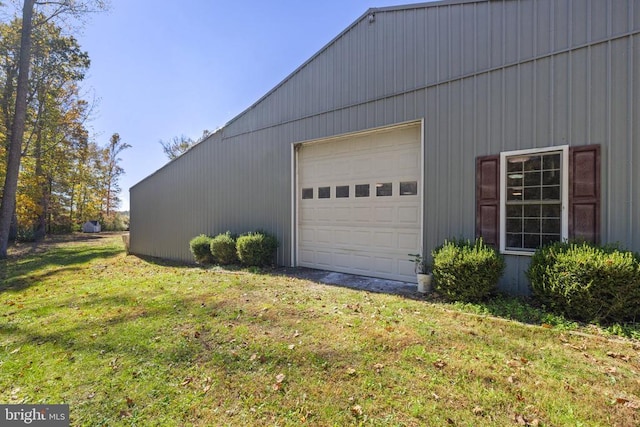 garage featuring a yard