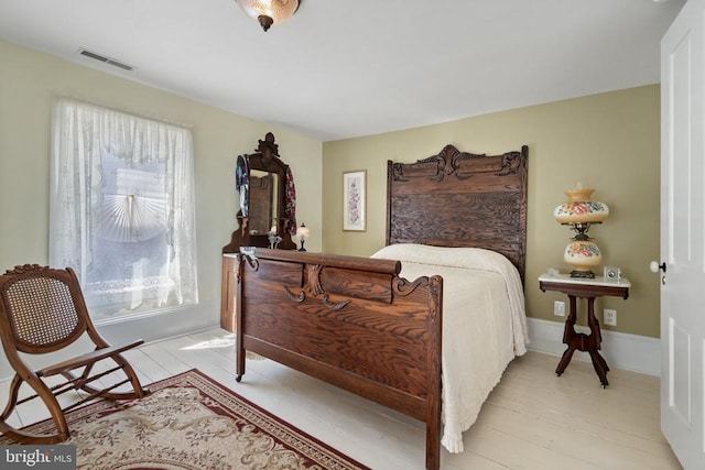 bedroom featuring visible vents