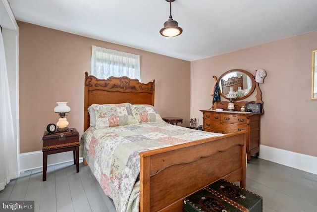 bedroom featuring baseboards