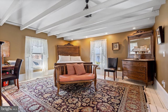 bedroom featuring recessed lighting, baseboards, beam ceiling, and wood finished floors