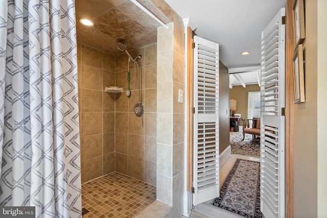 full bathroom featuring recessed lighting and tiled shower