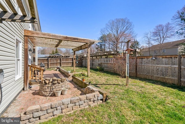 view of yard featuring a pergola, a fenced backyard, and a garden