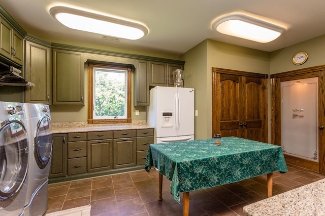 washroom featuring cabinets and independent washer and dryer