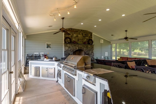 view of patio / terrace featuring a grill, exterior kitchen, and sink