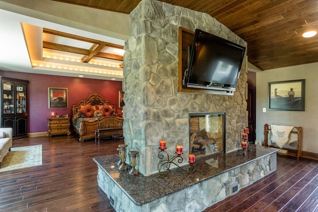 living room featuring a stone fireplace, dark hardwood / wood-style floors, and wood ceiling