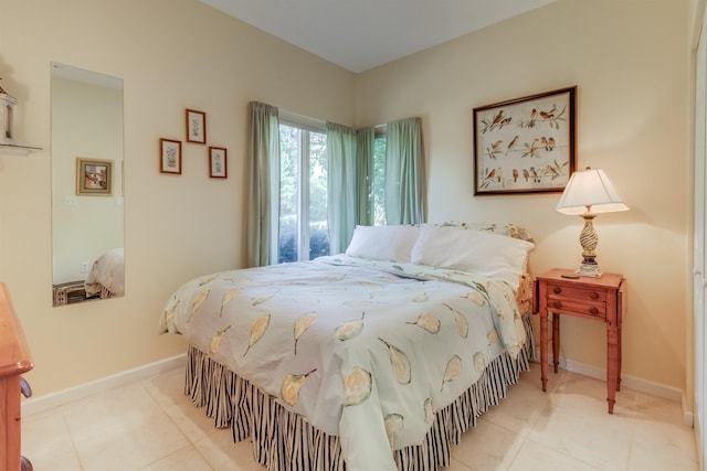 bedroom with light tile patterned floors