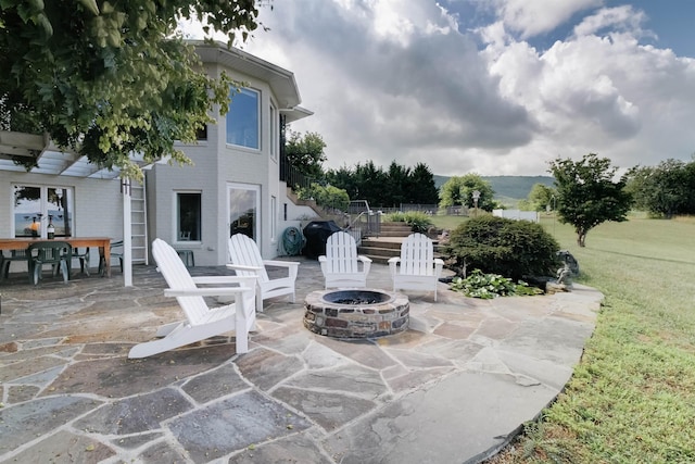 view of patio featuring a grill and a fire pit